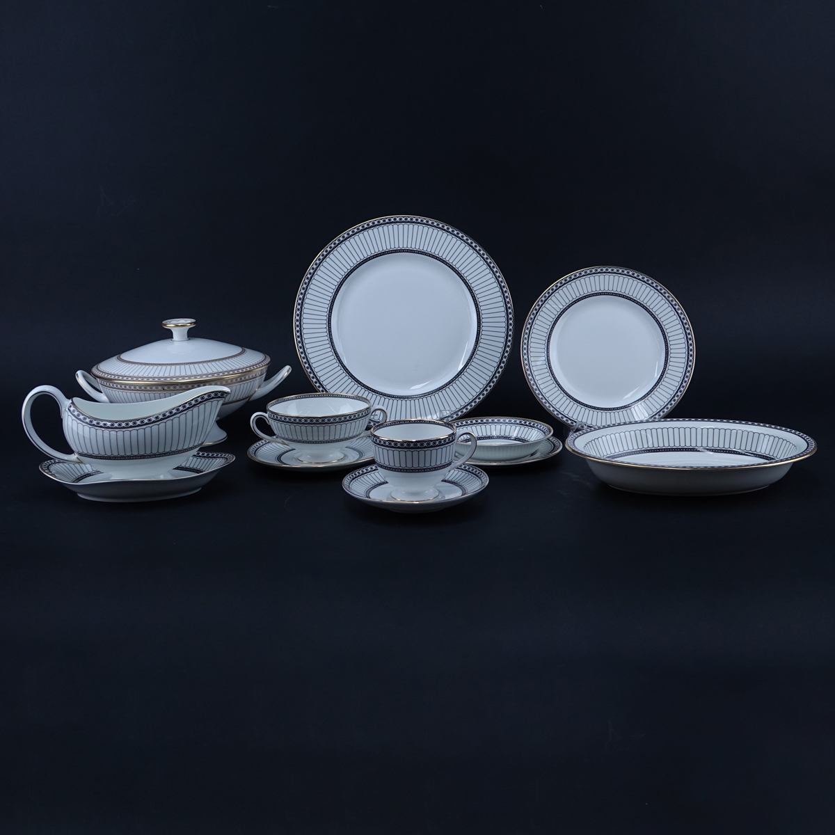One Hundred Nine (109) Piece Wedgwood Colonnade Dinnerware. Includes in black: 12 plates 10-3/4", 12 salad plates, 12 bread & butter plates, 12 fruit bowls, 12 handled soup cups and 12 saucers, 16 ups and 16 saucers, gravy boat, 2 open serving dishes.