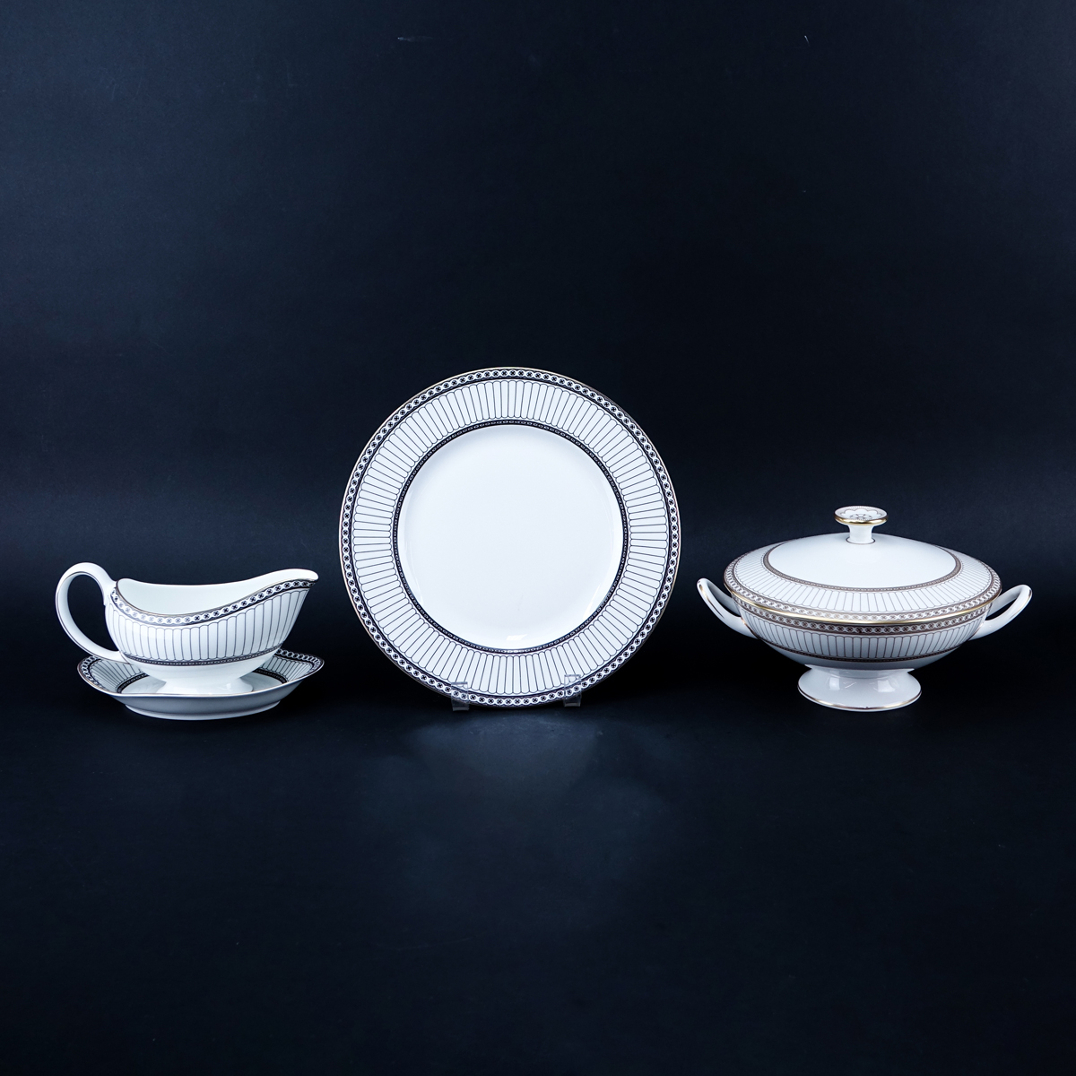 One Hundred Nine (109) Piece Wedgwood Colonnade Dinnerware. Includes in black: 12 plates 10-3/4", 12 salad plates, 12 bread & butter plates, 12 fruit bowls, 12 handled soup cups and 12 saucers, 16 ups and 16 saucers, gravy boat, 2 open serving dishes.