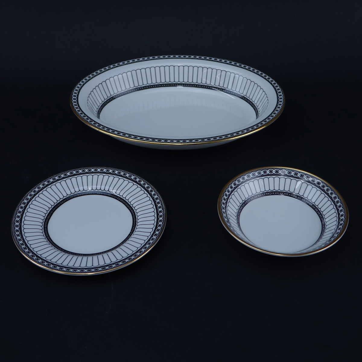 One Hundred Nine (109) Piece Wedgwood Colonnade Dinnerware. Includes in black: 12 plates 10-3/4", 12 salad plates, 12 bread & butter plates, 12 fruit bowls, 12 handled soup cups and 12 saucers, 16 ups and 16 saucers, gravy boat, 2 open serving dishes.