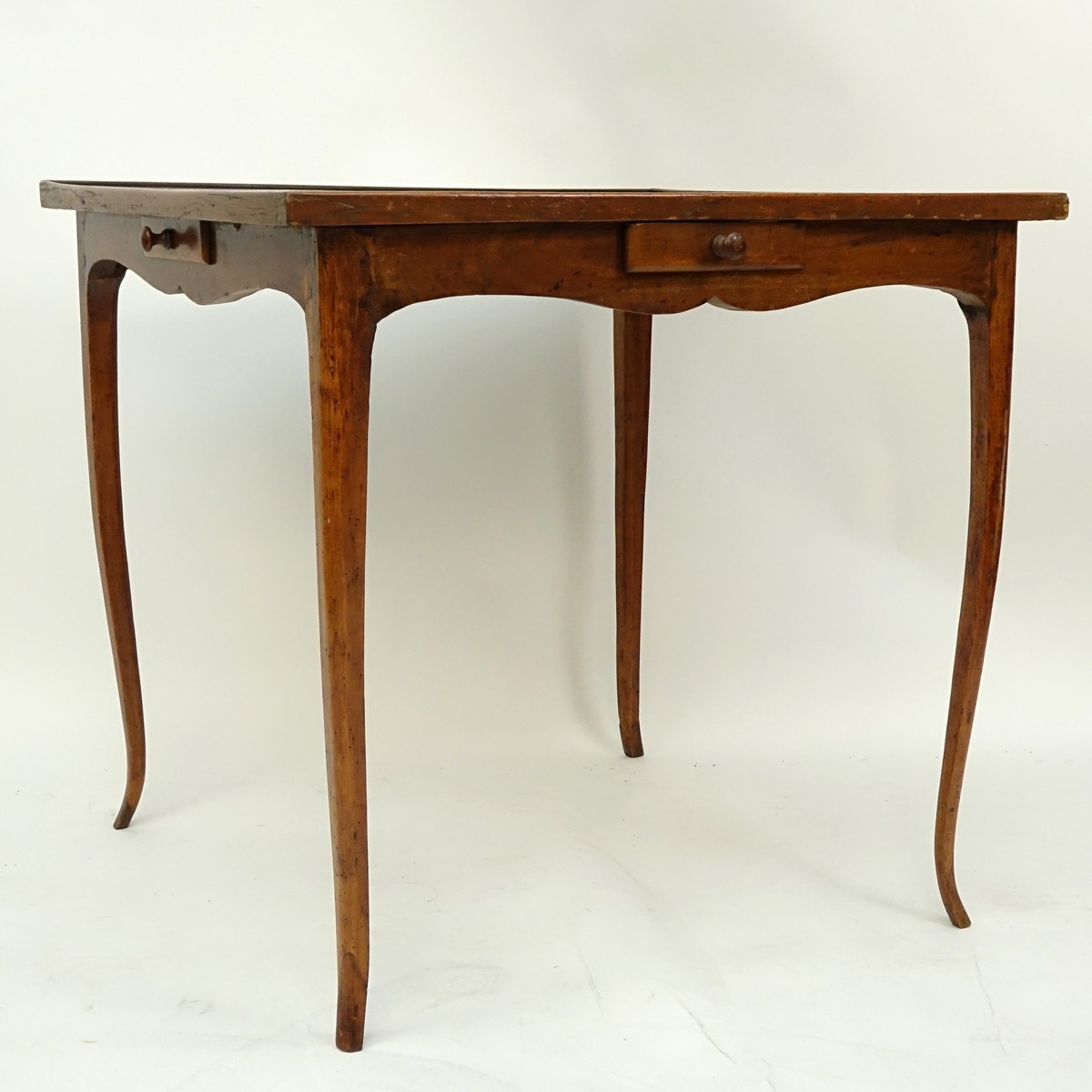 Louis XV Style Game Table with Tooled Leather Top. Four sliding drawers on opposite ends, label attached en verso.