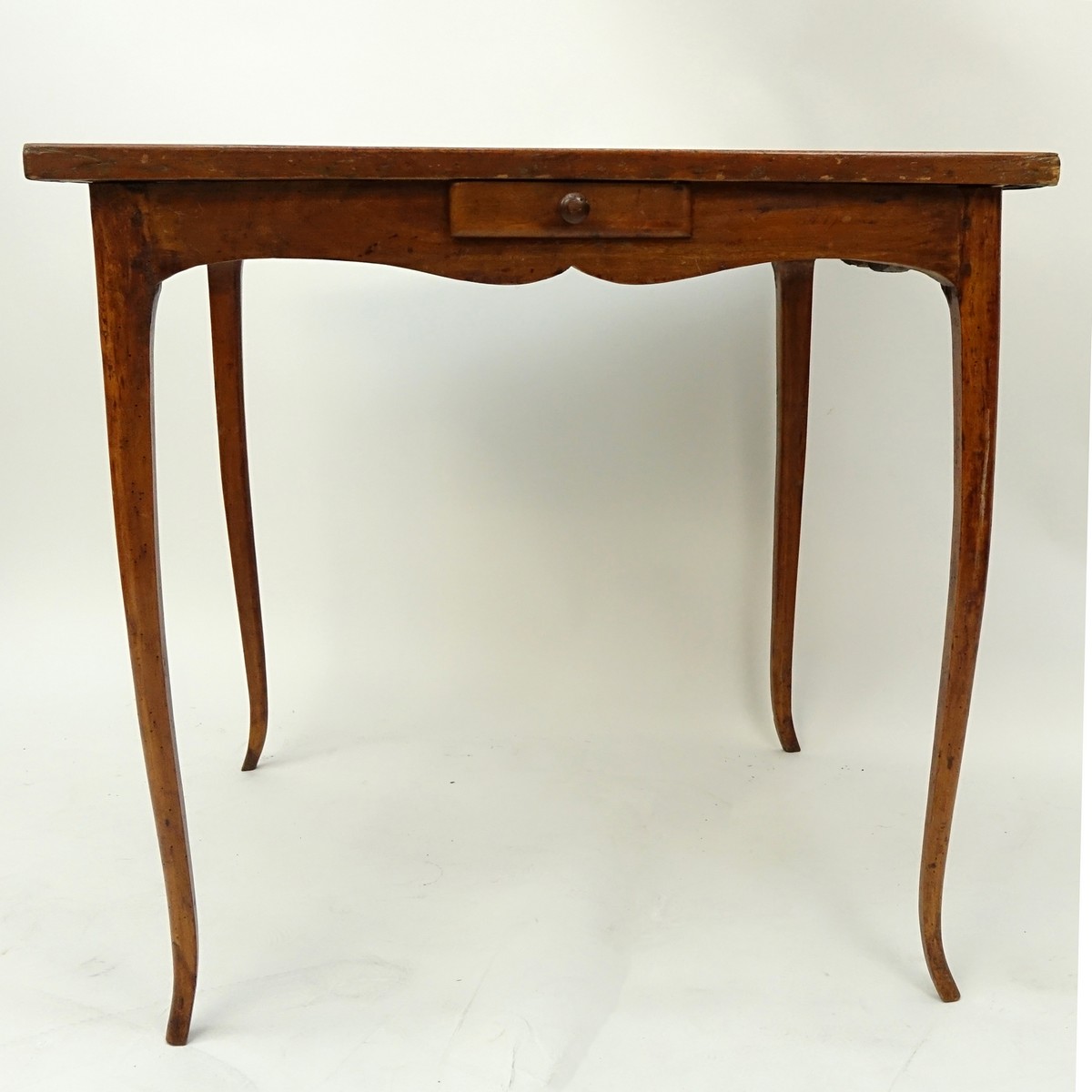 Louis XV Style Game Table with Tooled Leather Top. Four sliding drawers on opposite ends, label attached en verso.