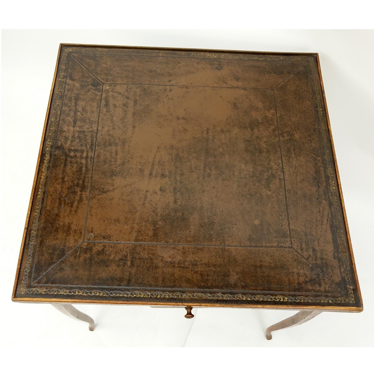 Louis XV Style Game Table with Tooled Leather Top. Four sliding drawers on opposite ends, label attached en verso.