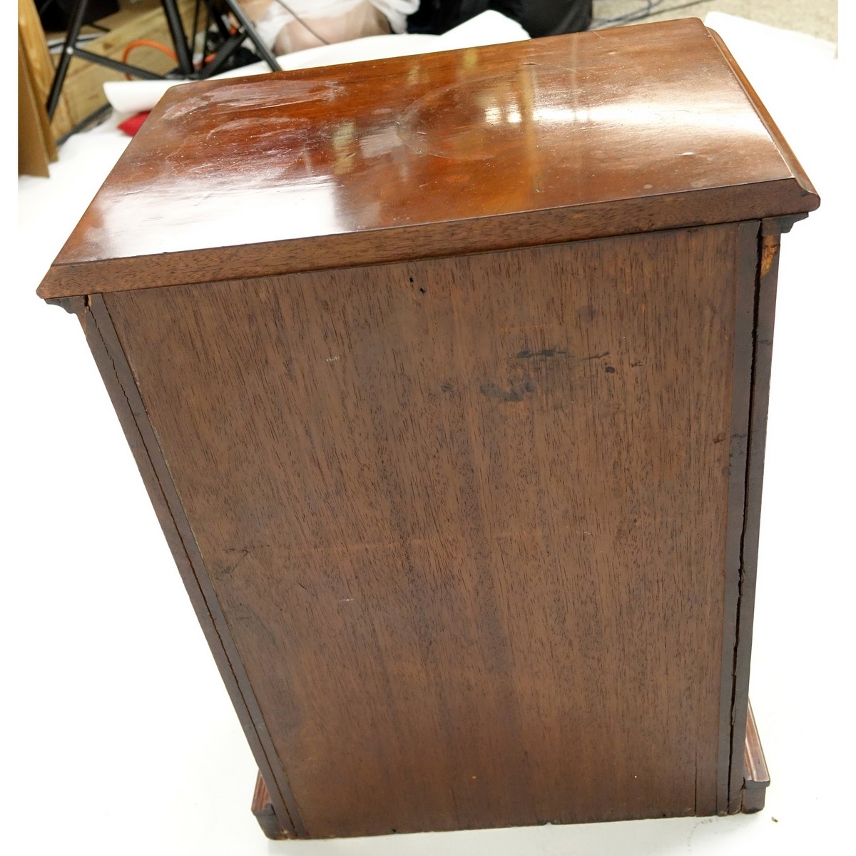 Antique English Miniature Chest of Drawers. Some losses to molding, wear to varnish, light scuffs otherwise good condition.