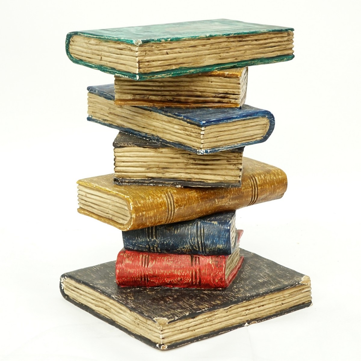 Hand Carved and Painted End Table in the form of Stacked Books. Wear to the corners at the base, rubbing to paint.