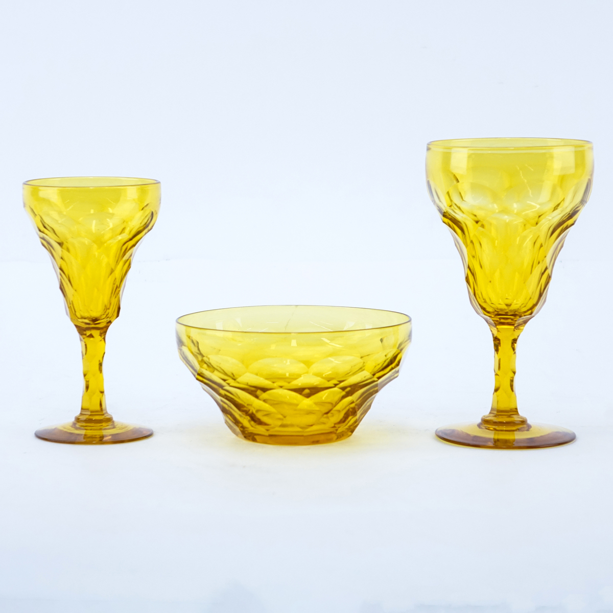 Twenty Eight (28) Piece Vintage Amber Crystal Stemware. Set includes: 10 goblets 6-1/4" H , 12 wine glasses 5-1/2", 6 bowls 3".