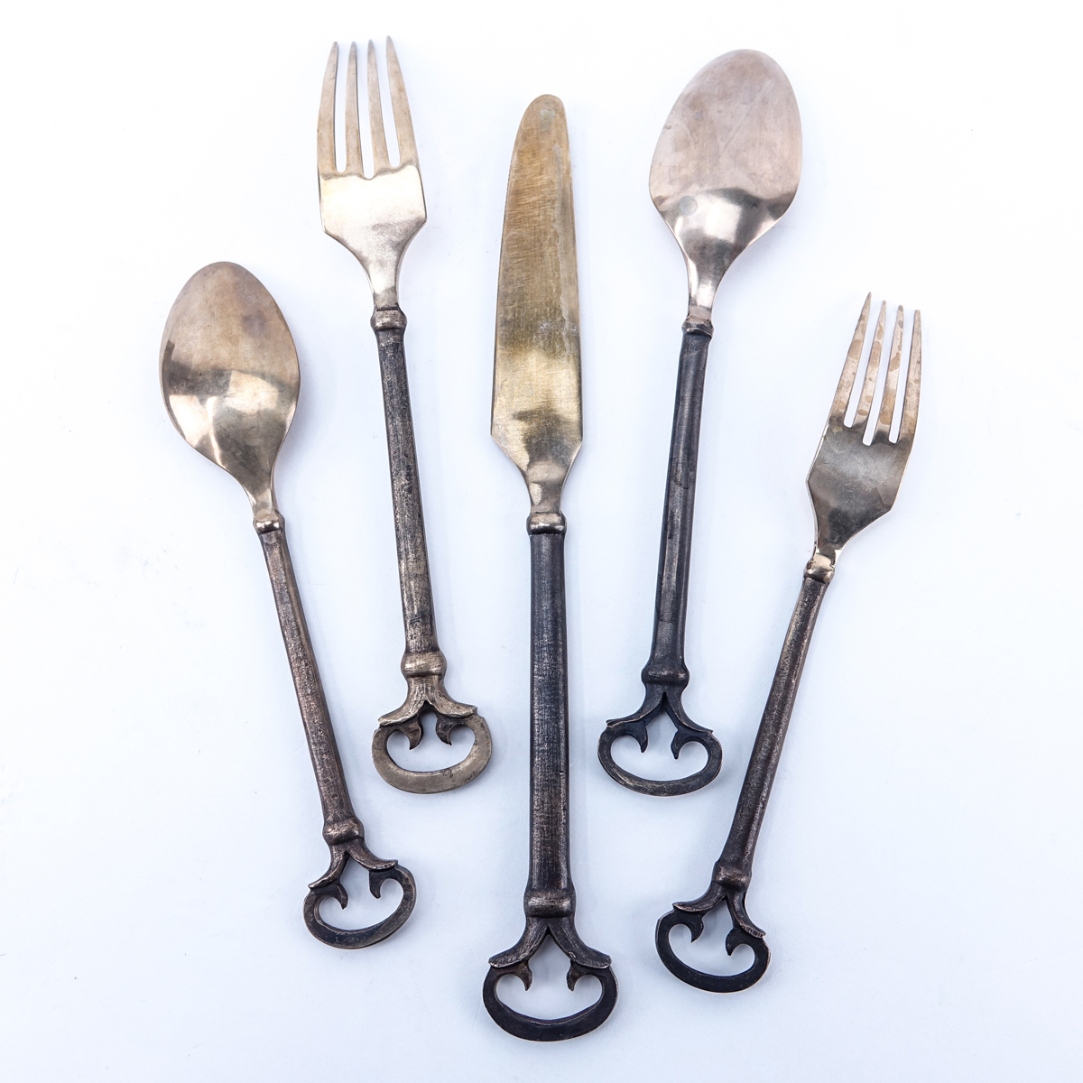 Forty (40) Piece Set Antique Solid Brass Flatware. Includes 8 each: forks 8-1/8", knives 9-1/2", salad forks, place spoons, teaspoons.
