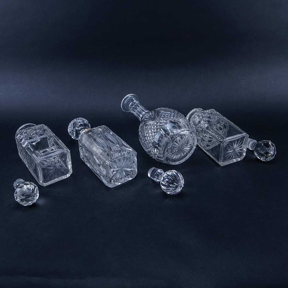Collection of Four (4) Crystal Decanters. Unsigned.