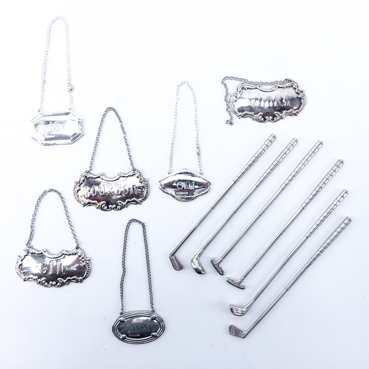 Grouping Of Silver Plate Bar Accessories. Includes: Reed & Barton shaker/decanter, Towle shaker, Towle tumbler, 6 golf club motif stirrers, 6 decanter labels.