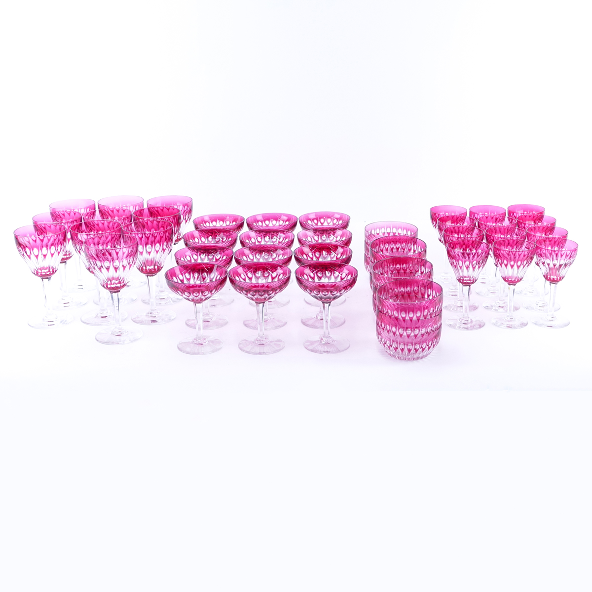 Forty Two (42) Piece Bohemian Style Cranberry to Clear Stemware. Includes: 9 red wine glasses 6-3/4" H, 12 white wines glasses 5-1/2" H, 9 champagne glasses 5" H, and 12 bowls 4" Dia.