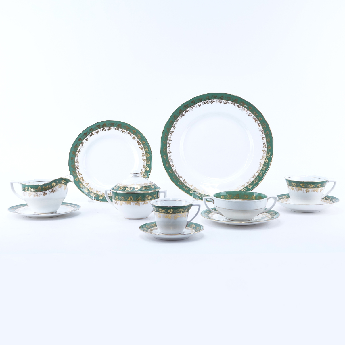 Sixty Nine (69) Piece Royal Worcester Arundel Green Partial Dinnerware Set. Includes: 11 dinner plates 10-3/4", 7 salad plates, 8 handled soup cups, 7 saucers, 4 cups, 5 saucers, 8 demitasse cups, 8 saucers, 9 bread and butter plates, creamer and sugar bo