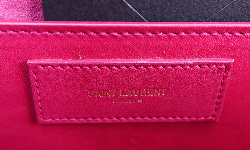 Saint Laurent Fuschia Leather Betty Handbag. Gold tone hardware and chain, suede interior with patch pocket.