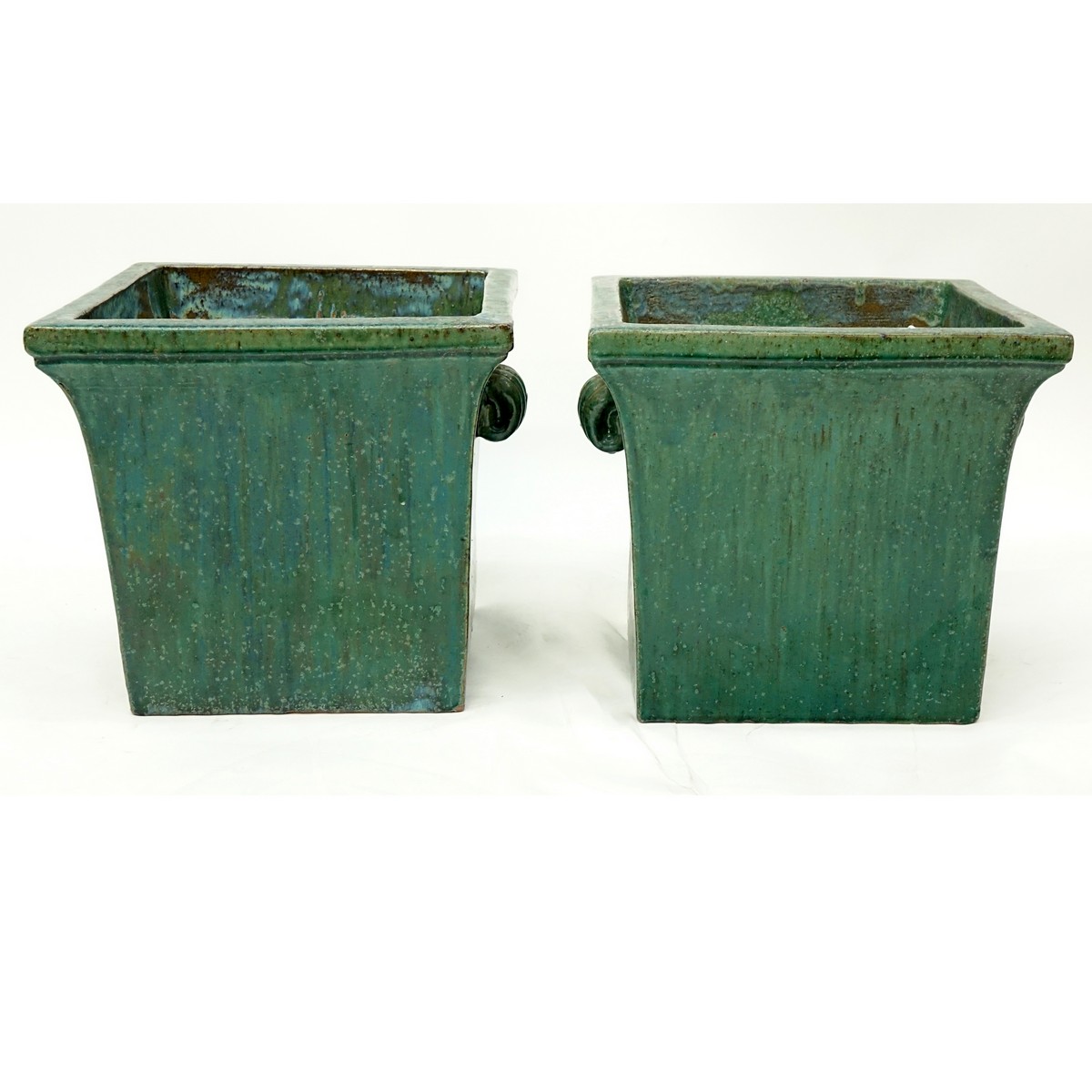 Pair of Large Chinese Style Green Glaze Pottery Jardinières with Mock Handles. Typical rubbing and spotting to glaze.