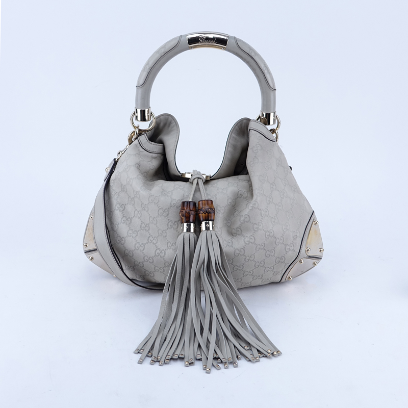 Gucci Beige Monogram Leather Indy Hobo Guccissima MM Bag. Gold tone hardware.