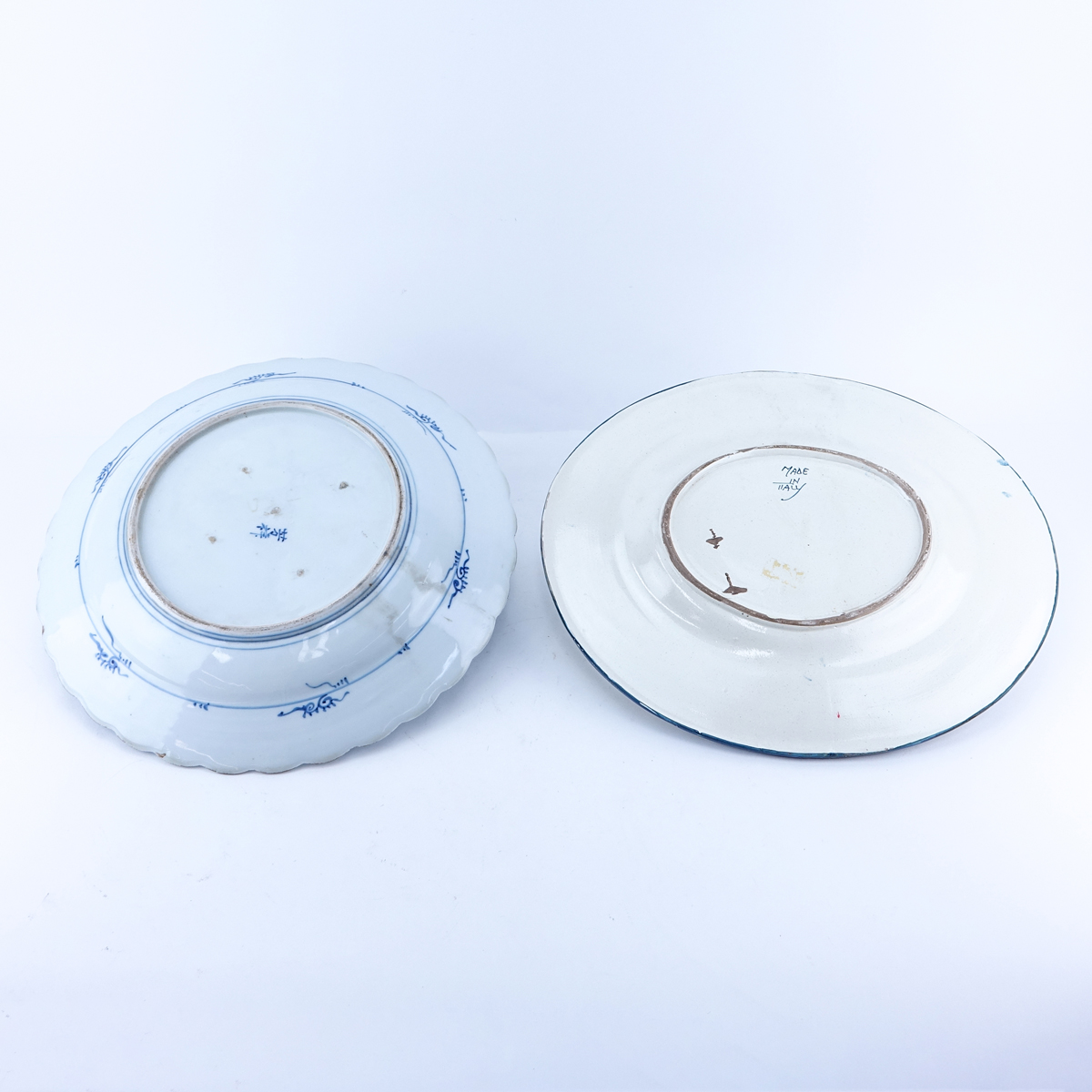 Grouping of Two (2): Large Italian Faience Blue and White Pottery Platters, Large Japanese Blue and White Porcelain Charger. Each signed to base.