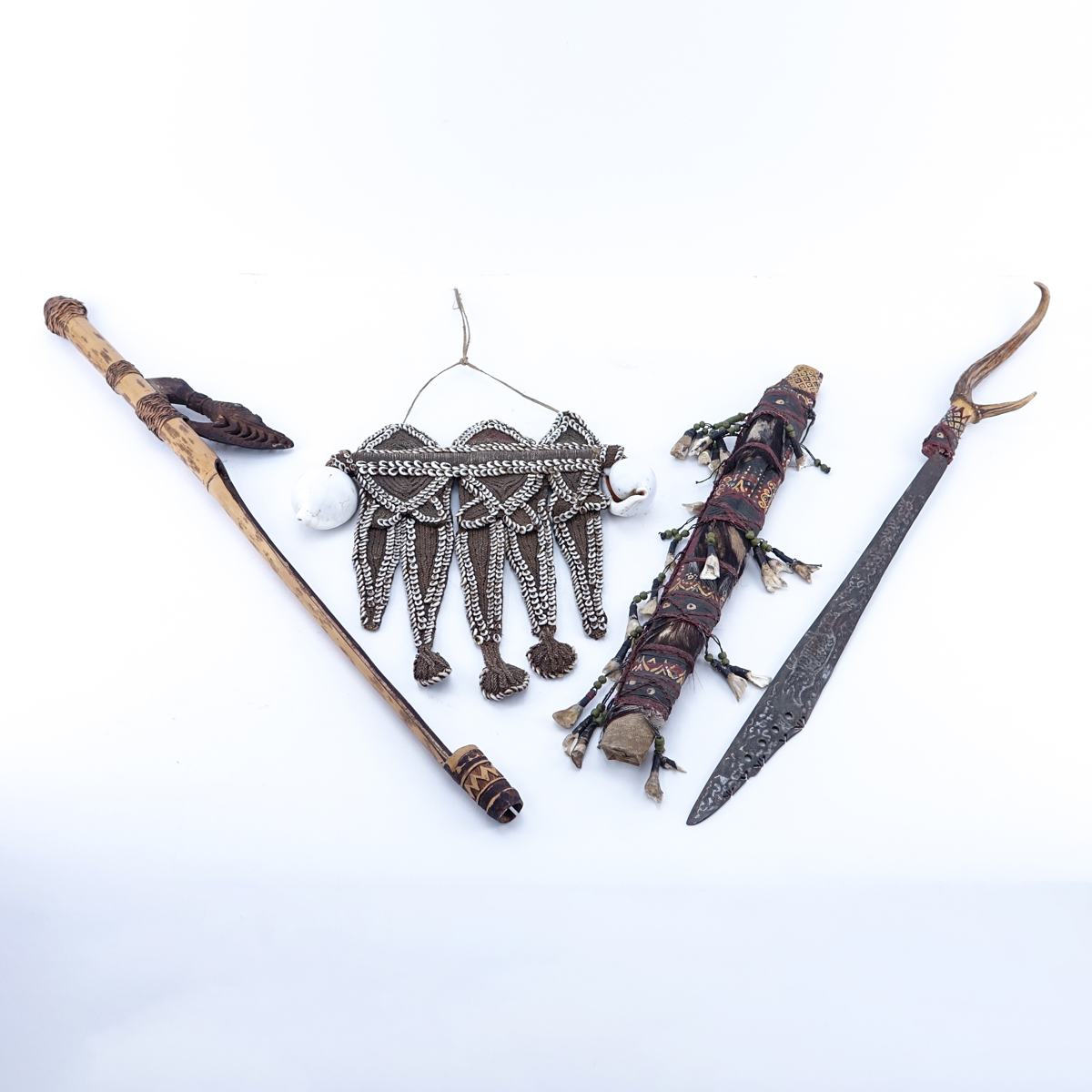 Antique Dayak Tribal Grouping of Three (3): Large Sword with Carved Antler Handle, Blowgun, and Beaded and Shell Hanging Ornament/Necklace. Condition is consistent with age, chips and nicks.