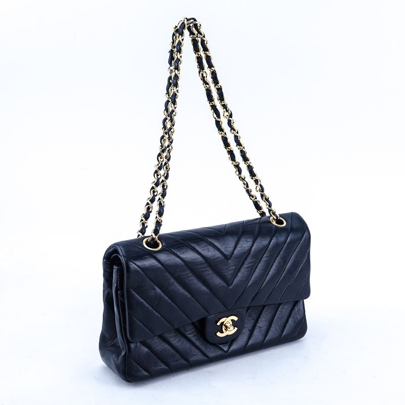 Chanel Black Quilted Chevron Motif Leather Double Flap Bag 23. Gold tone...