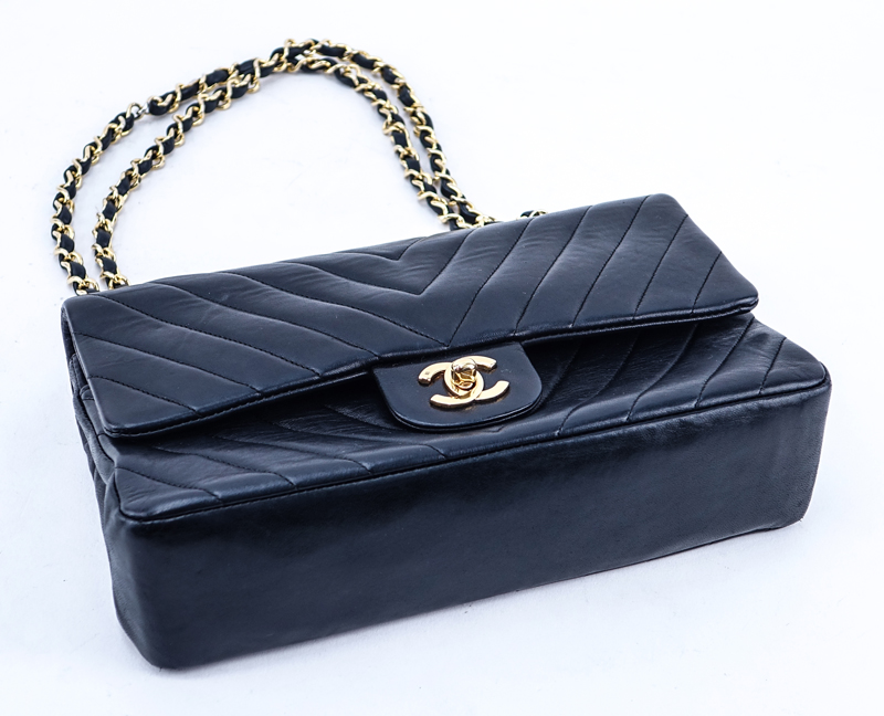 Chanel Black Quilted Chevron Motif Leather Double Flap Bag 23. Gold tone hardware.