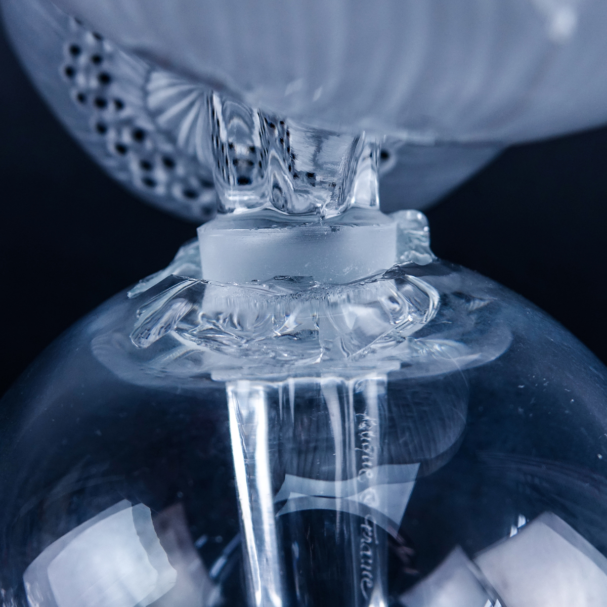 Group of Three (3): Pair of Lalique "Lily of the Valley" Crystal Perfume Bottles, Large Lalique "Anemone" Crystal Perfume Bottle. Each appropriately signed to base.