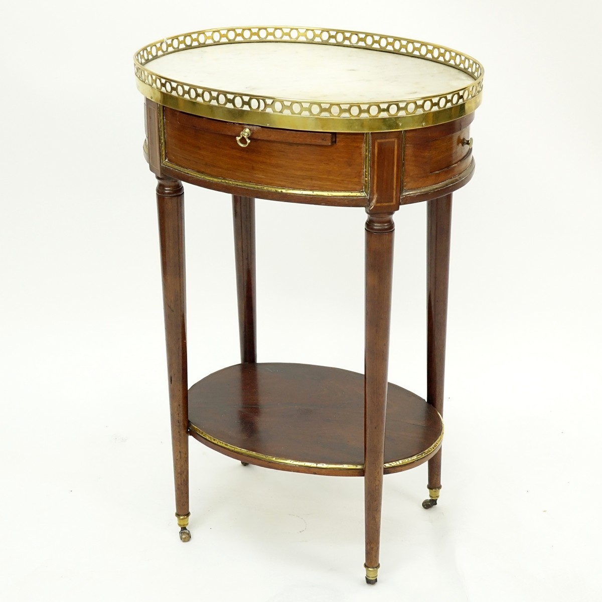 Early 20th Century French Gilt Bronze Mounted Occassional Table with Gallery. Two flanked drawers with top sliding platform.