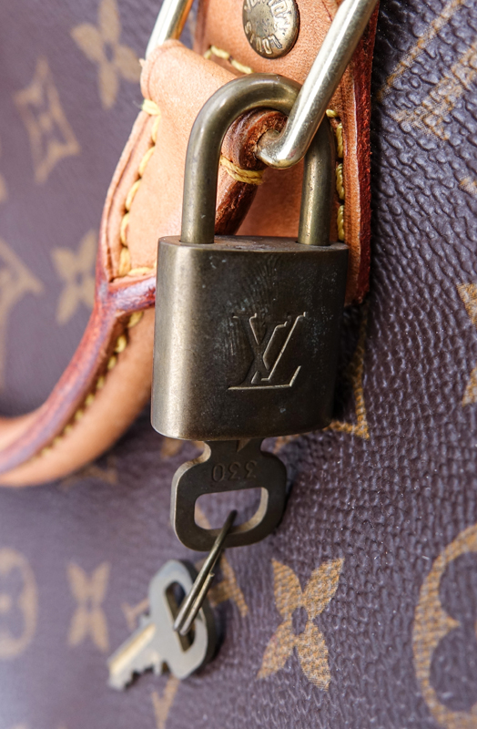 Louis Vuitton Brown Monogram Coated Canvas Speedy 40 Tote. Golden brass hardware, vachetta straps.