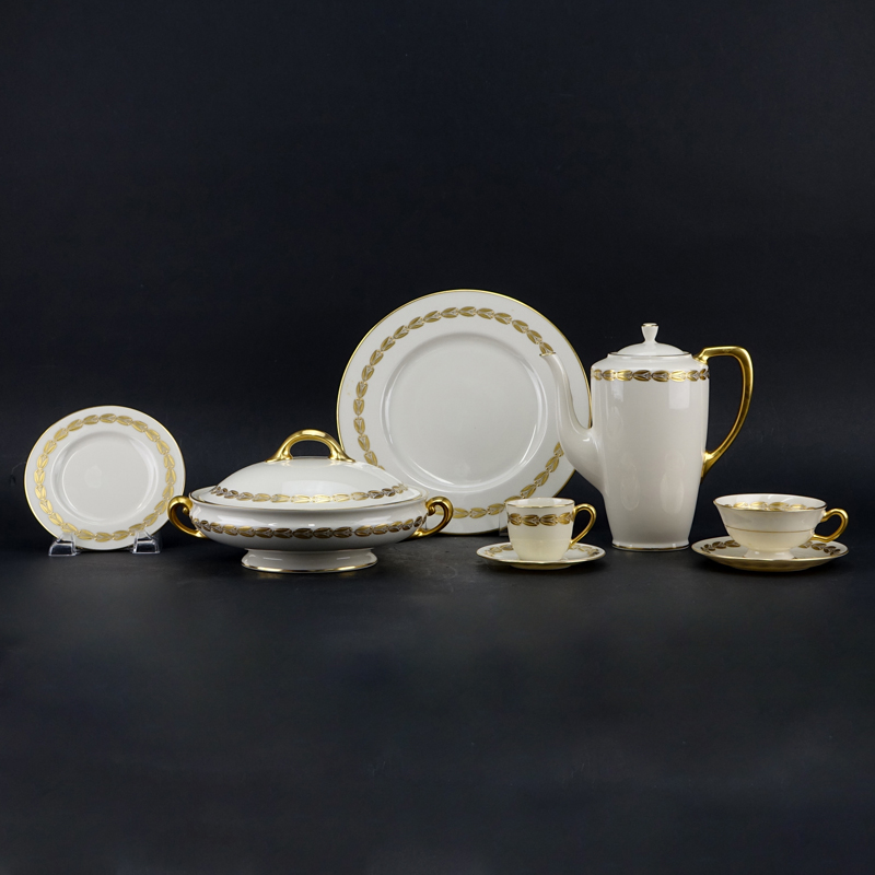 Forty One (41) Pieces Lenox Antoinette Ivory Dinnerware. Includes: 8 dinner plates 10-1/2", 8 bread & butter plates, 7 footed cups with 8 saucers, 8 demitasse cups with 8 saucer, coffee pot, covered vegetable.