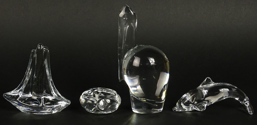 Lot of four (4) Crystal Animal Figurines. Includes Baccarat Pelican, 6-1/2 Inches; Daum France Sailboat; Daum Dolphin; Steuben Bunny.