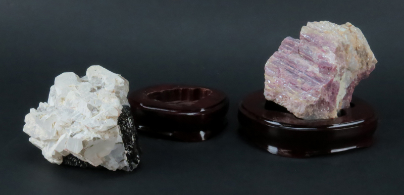 Two (2) Agate Mineral Specimens on Wooden Stands. Both are unpolished with various shades.