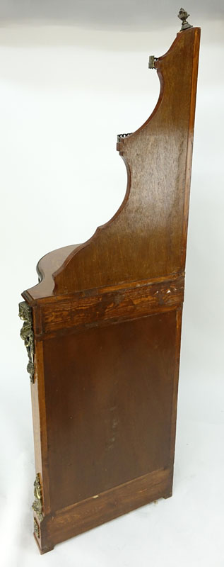 20th Century Louis XVI Style Mahogany Floral Inlaid, Bronze Mounted Corner Cabinet. Serpentine form with single fitted drawer and glass door, gallerie gate to top and interior shelves, figural mounts flaking the corners.