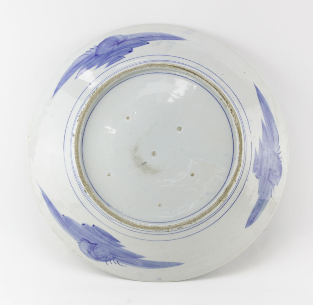 19th Century Japanese Arita Blue and White Porcelain Charger. Decorated blue glaze butterfly and flower scene, blue glazed pattern and pin pricks on underside.