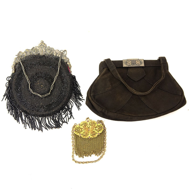 Grouping of Three (3) Antique or Vintage Ladies' Purses. Includes: brown suede purse with art deco clasp, black beaded purse with art nouveau repousse clasp, and mesh coin purse with gilt art nouveau clasp.