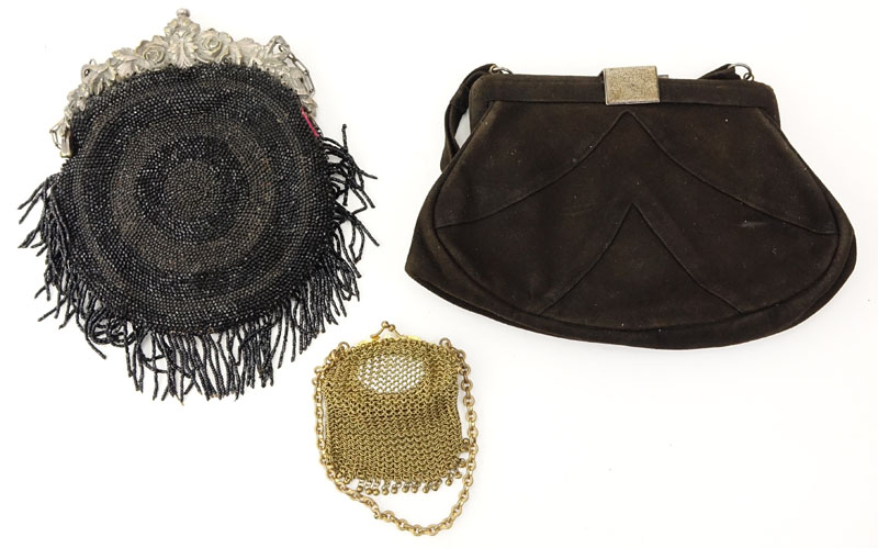 Grouping of Three (3) Antique or Vintage Ladies' Purses. Includes: brown suede purse with art deco clasp, black beaded purse with art nouveau repousse clasp, and mesh coin purse with gilt art nouveau clasp.