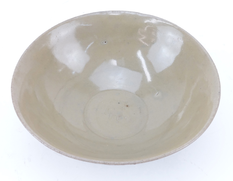 Chinese Song Dynasty or After Celadon Bowl. Impressed mark center bowl, lotus petals motif on outer surface.