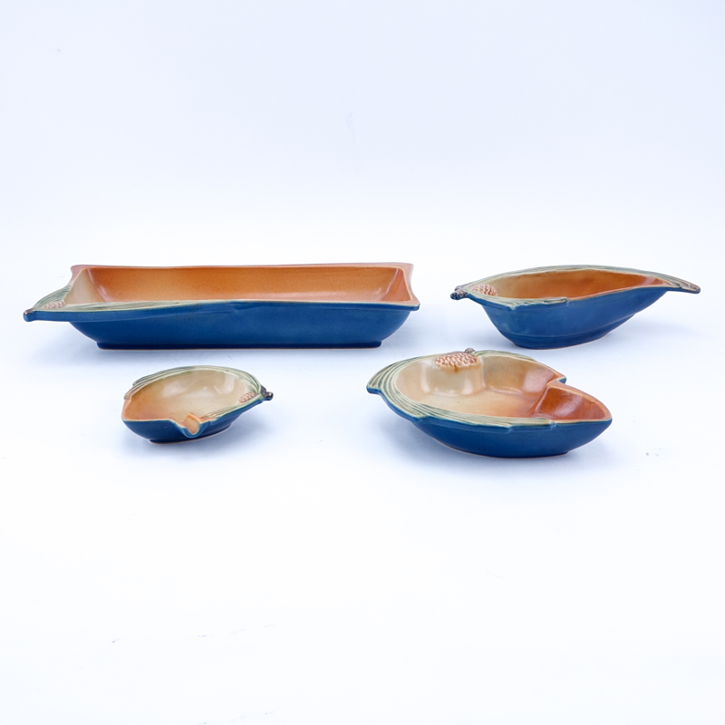 Four Pieces Roseville Blue Pine Cone Pottery Table Wares. Includes various shaped serving dishes.