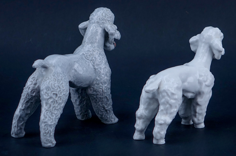 Two Porcelain Poodle Figurines. One signed with Meissen mark, one with Rosenthal mark.