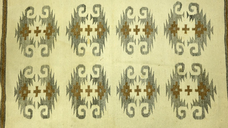 Vintage Navajo Geometric Rug. Mainly beige in color with geometric designs in brown and grey.
