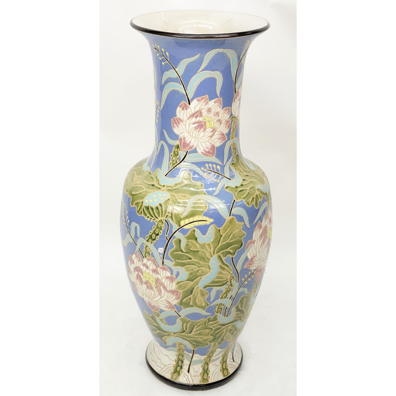 Monumental Majolica Pottery Vase. Features Asian inspired lotus flower motif on blue ground.