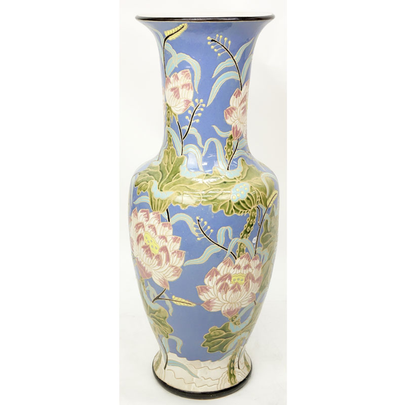 Monumental Majolica Pottery Vase. Features Asian inspired lotus flower motif on blue ground.