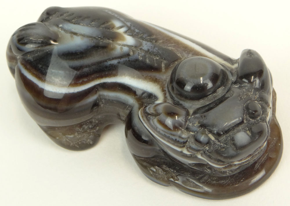 Chinese Carved Agate Recumbent Buddhist Lion Figure. Unsigned.