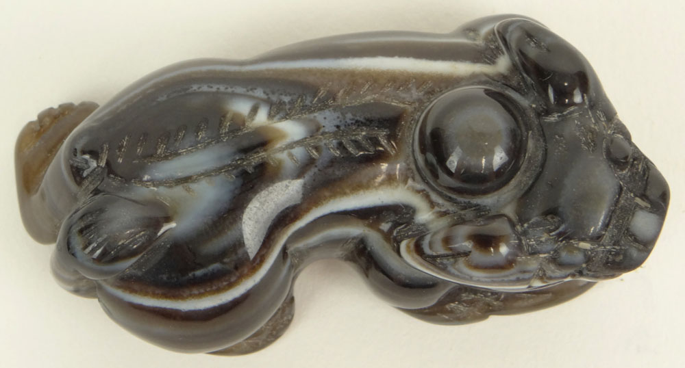 Chinese Carved Agate Recumbent Buddhist Lion Figure. Unsigned.