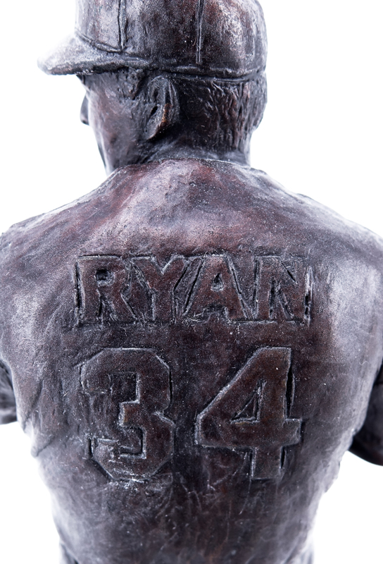 A Bronze Sculpture of Nolan Ryan Mounted on Wooden Base by Southland Art Castings. Includes original COA, Sticker label to base numbered 38/100, and tag inscribed "Nolan Ryan" to base.