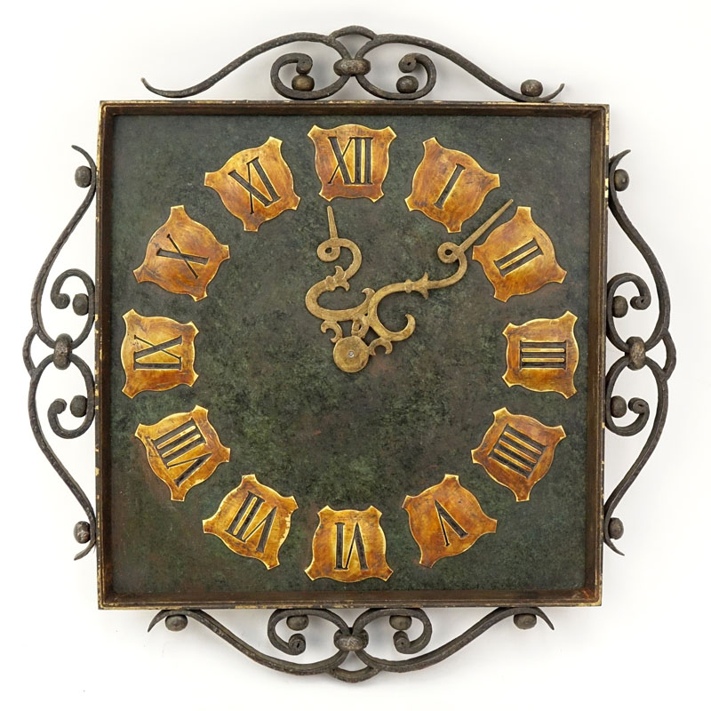 Vintage Wrought Iron Wall Clock. Roman numeral display with decorative hands.