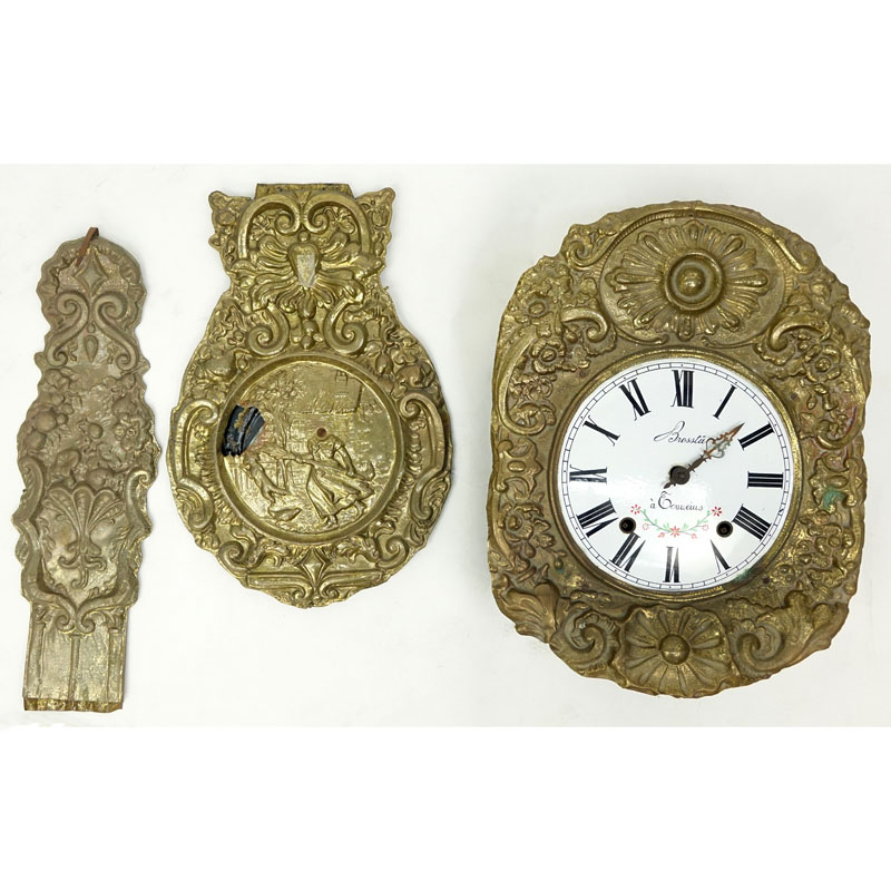 Antique French Brass High Relief Morbier Clock. Inscribed on dial with Roman numerals and decorative hands.