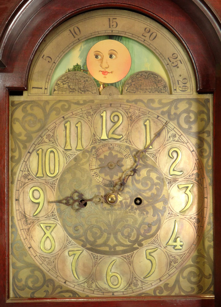 Antique German Grandfather Clock Retailed by Hershede. Mahogany Bonnet Top Case with Urn Finials and Pillar Sides.