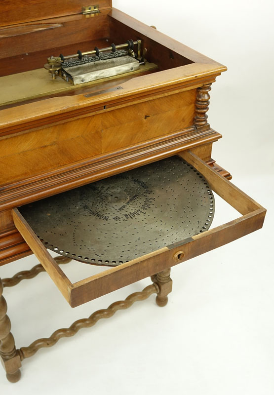 Antique Polyphon Brevete SGDG Music Box with 38 Discs atop a Associated Base. Walnut case with floral inlay top.