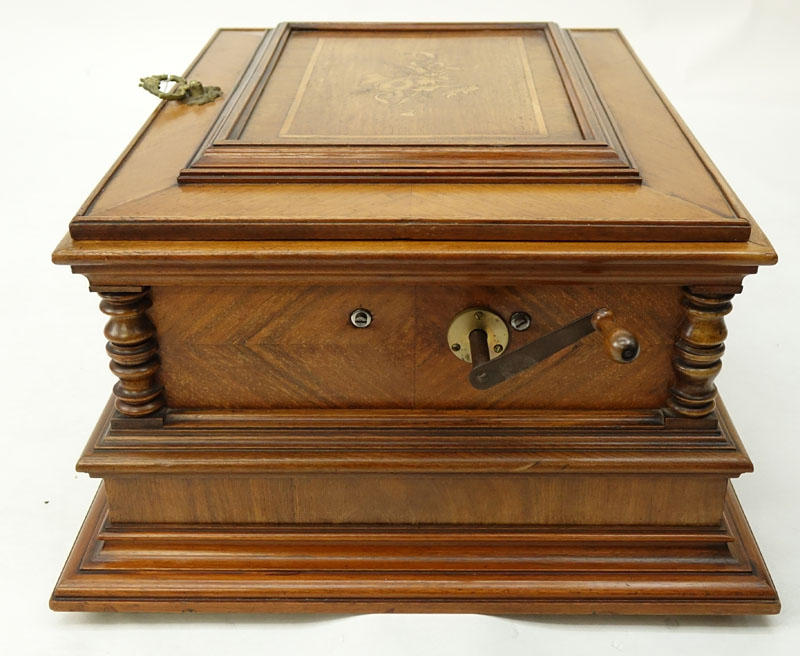 Antique Polyphon Brevete SGDG Music Box with 38 Discs atop a Associated Base. Walnut case with floral inlay top.