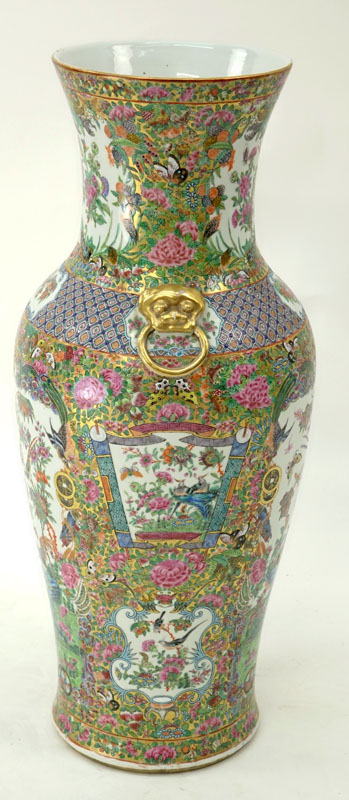 Large Chinese Rose Canton Porcelain Vase with Mock Foo Dog Ring Handles. Enamel and gilt painted panels of birds, butterflies, coins, and exotic flowers.