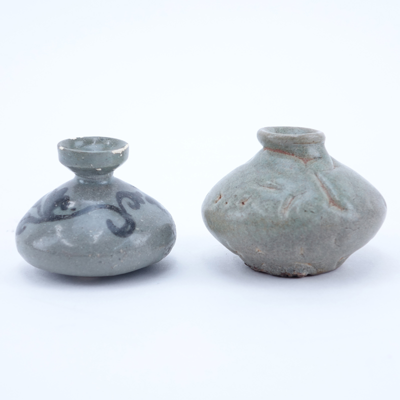 Two (2) Chinese Goryeo Dynasty, 12th - 14th Century Celadon Glazed Oil Bottles. One decorated in black slip with two leafy sprigs; the other covered with a crackled glaze.