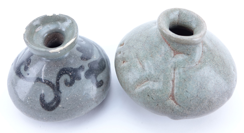 Two (2) Chinese Goryeo Dynasty, 12th - 14th Century Celadon Glazed Oil Bottles. One decorated in black slip with two leafy sprigs; the other covered with a crackled glaze.