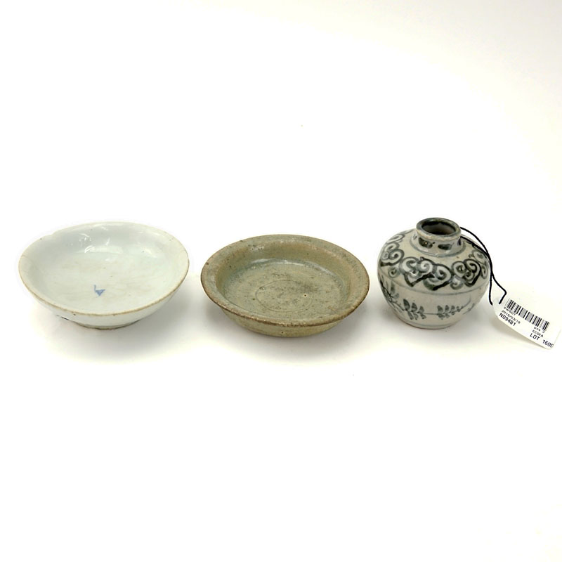 Two 16th - 19th Century Small Glazed Dishes And A Small Jar. Lot includes a 19th century white glazed dish, with underglaze blue decoration; the second a 16th century green-glazed pottery dish; together with a small Vietnamese underglaze blue jar.