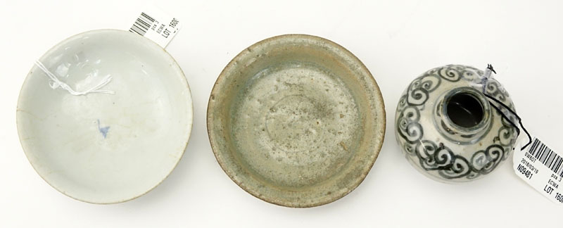 Two 16th - 19th Century Small Glazed Dishes And A Small Jar. Lot includes a 19th century white glazed dish, with underglaze blue decoration; the second a 16th century green-glazed pottery dish; together with a small Vietnamese underglaze blue jar.